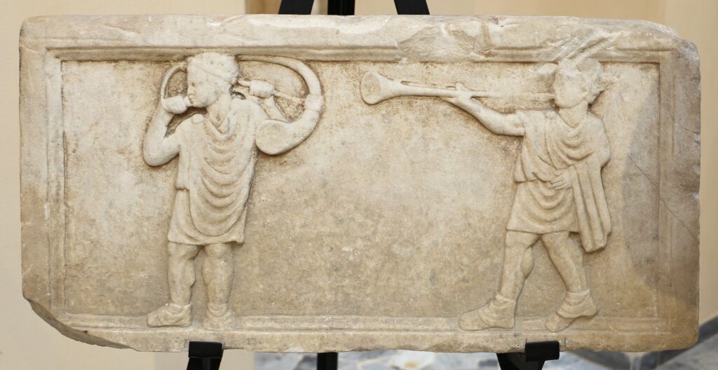 Let All Things Be Done Decently And In Order 1 A Roman marble relief of soldiers playing the tuba and cornu