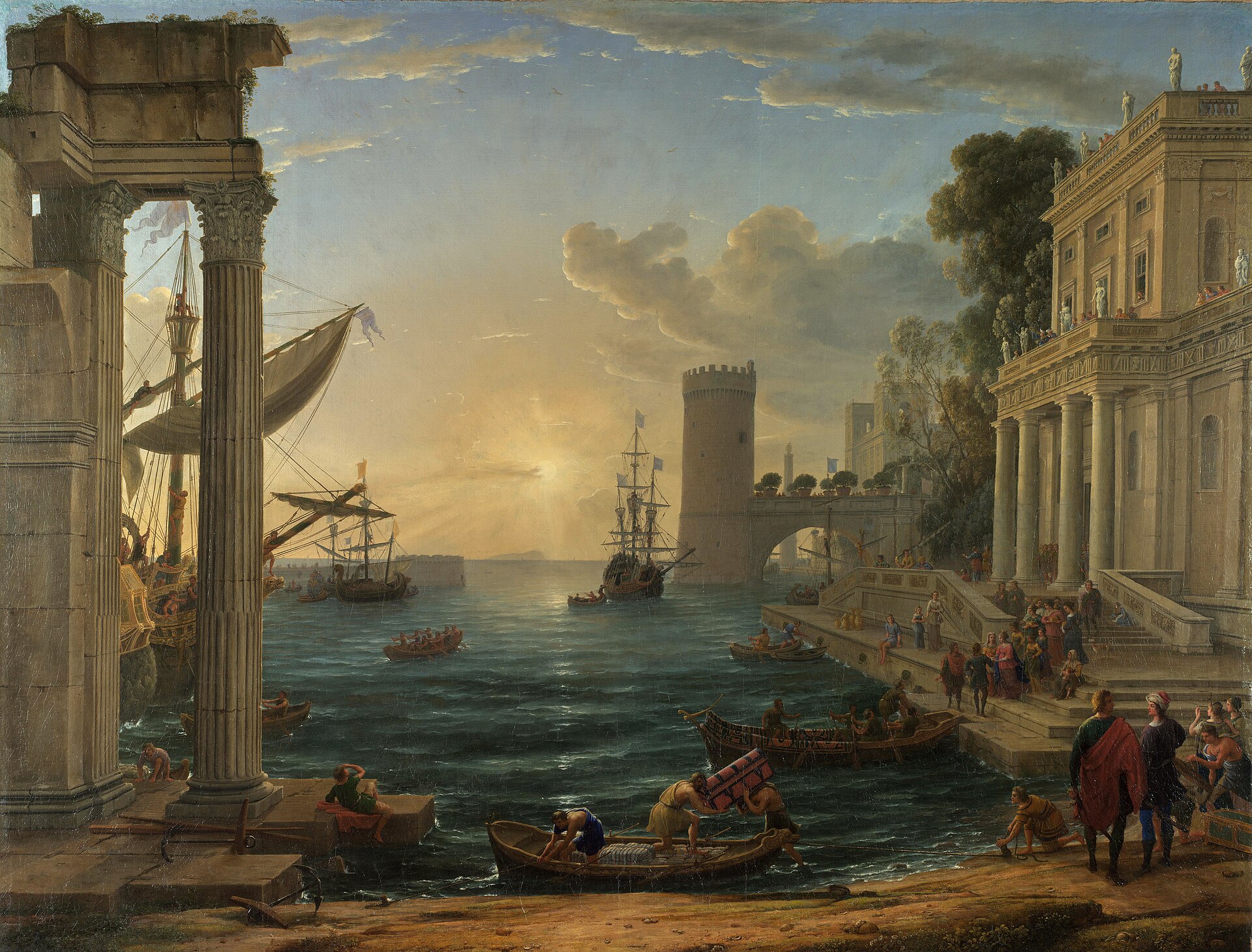 A golden sun low over a harbour between classical palaces and a ruined colonnade, sailing ships at anchor and small boats ferrying chests to shore as a queen and her attendants descend the palace steps