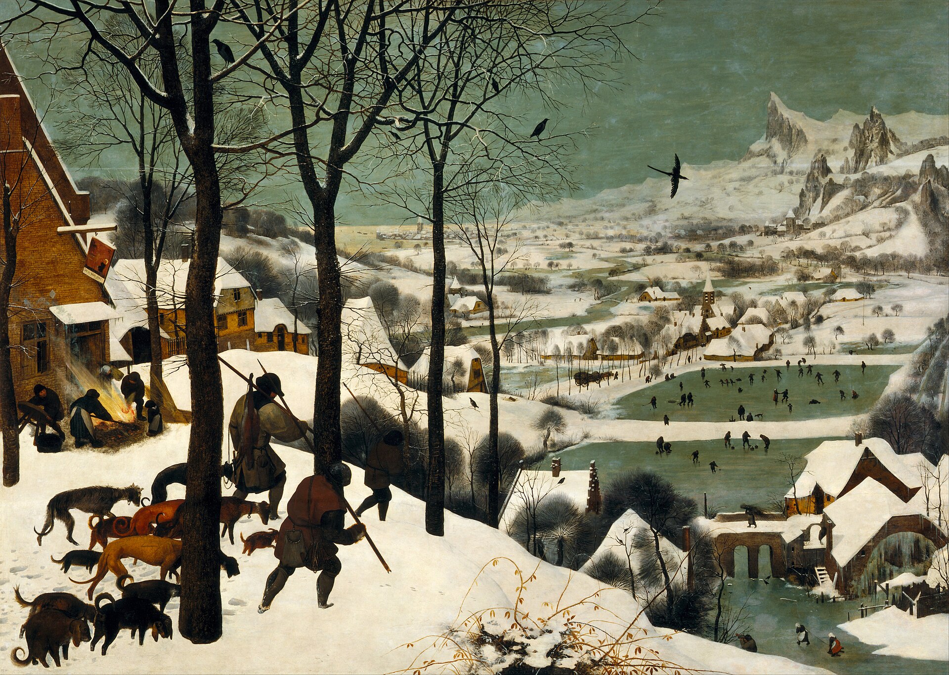 Three hunters and their dogs trudge down a snowy hill past bare trees toward a winter village, where skaters play on frozen ponds in a wide valley beneath grey-green sky and jagged mountains