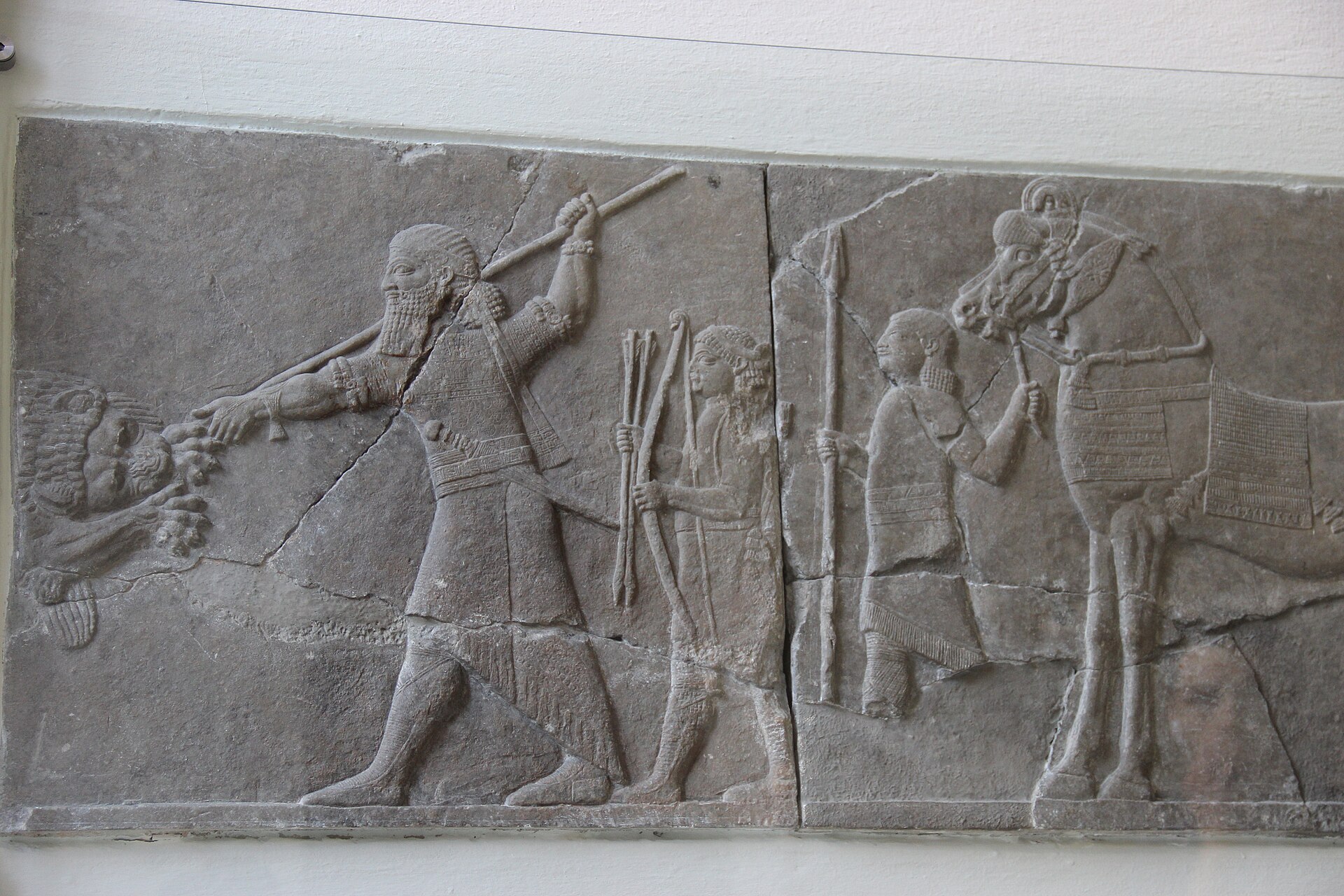 Assyrian palace relief of King Ashurbanipal hunting a lion, from the North Palace at Nineveh, 7th century B.C.