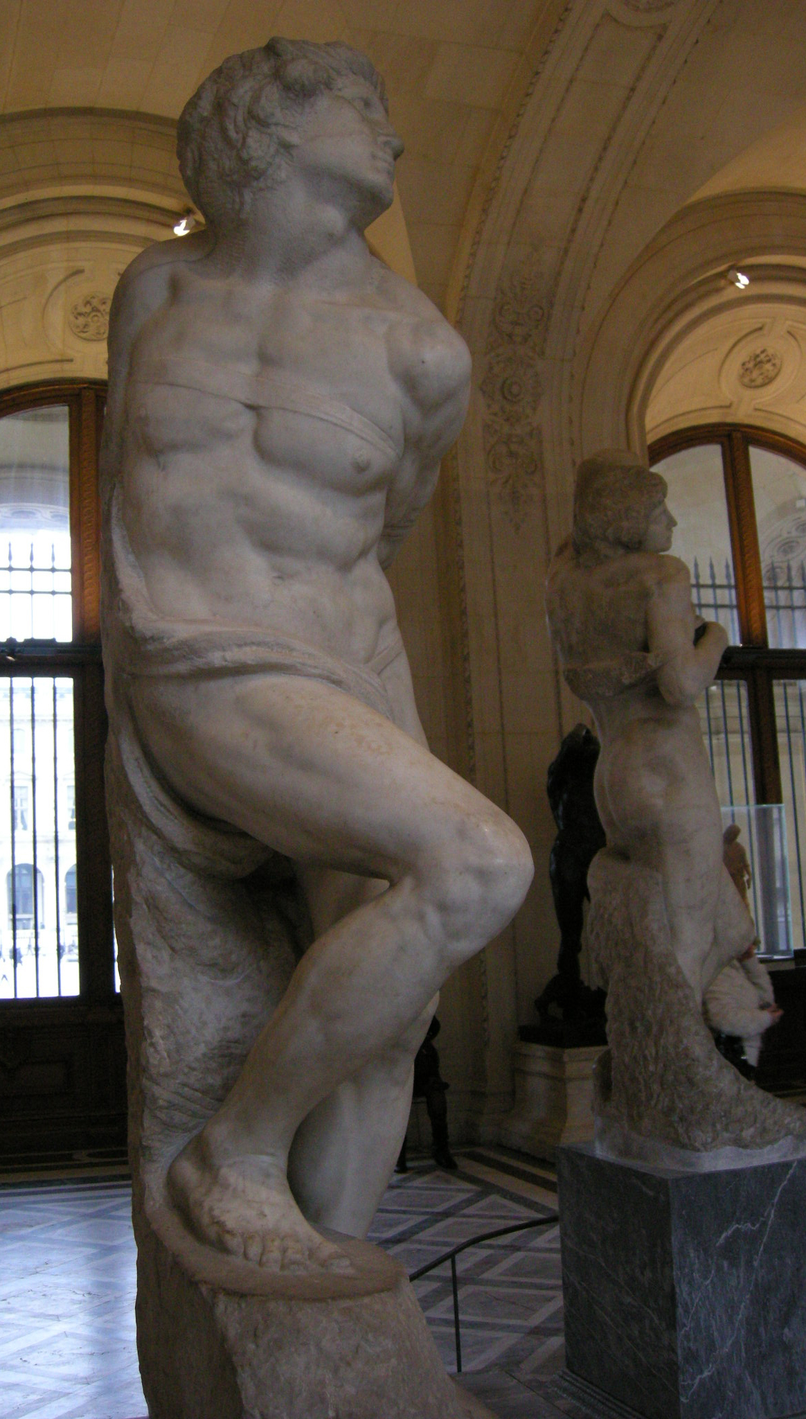 Michelangelo's sculpture The Rebellious Slave, a figure straining against its bonds