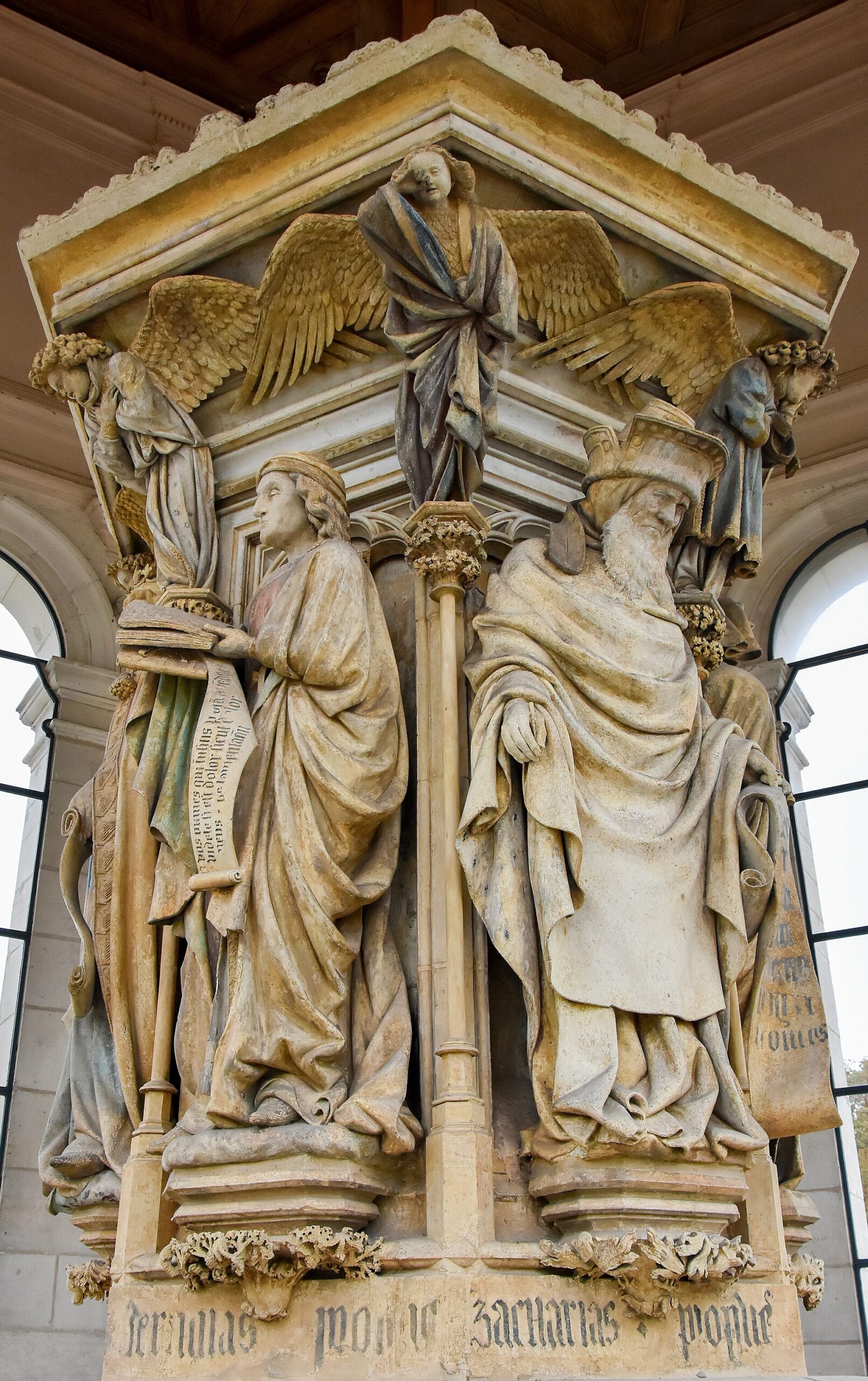 Before I Formed Thee In The Belly 1 Two stone prophets carved on a Gothic well, Jeremiah reading from an open scroll and Zechariah beside him, their names cut in the base below and angels with spread wings above